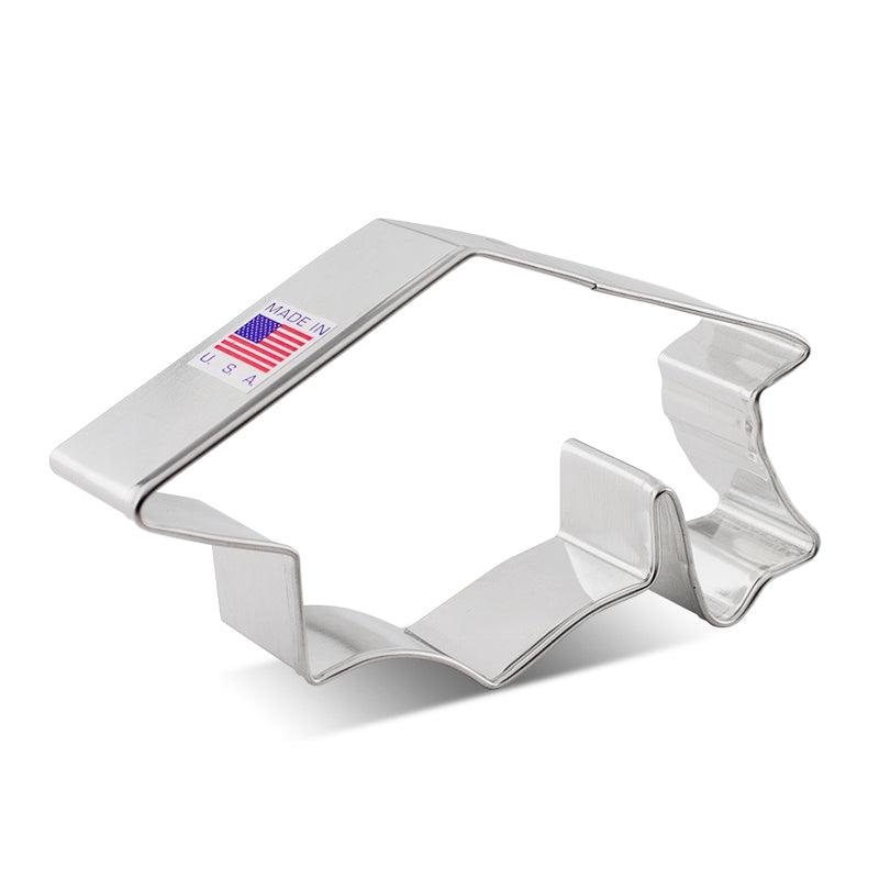 a graduation cap cookie cutter by Ann Clark Cutters. Size is 4 3/8"